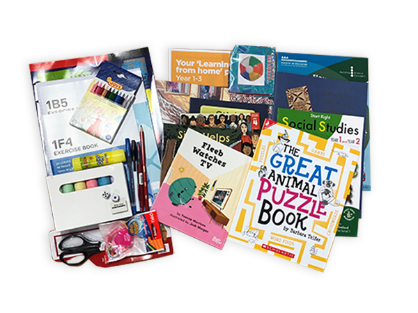 Photograph taken from above of the Year 2 hard pack. The pack contains various picture books, workbooks, exercise books and stationery.
