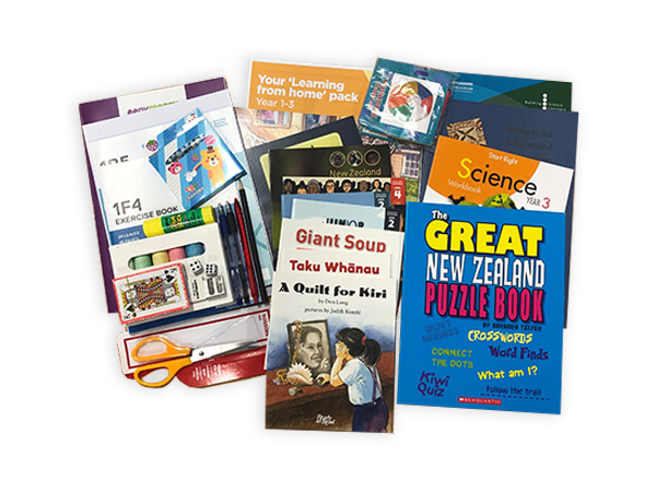 Photograph taken from above of the Year 3 hard pack. The pack contains various picture books, workbooks, exercise books and stationery.