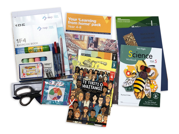 Photograph taken from above of the Year 5 hard pack. The pack contains various workbooks, exercise books and stationery.