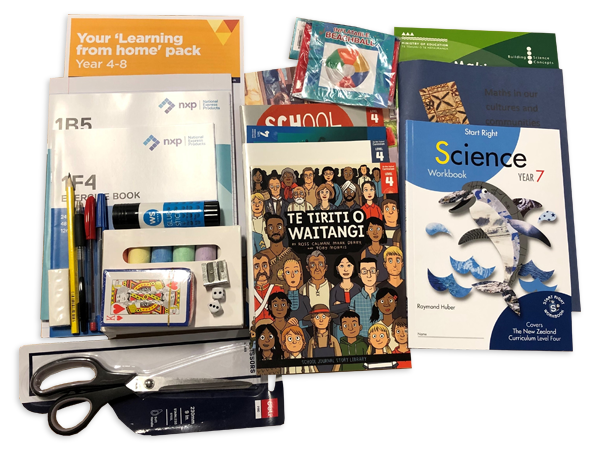 Photograph taken from above of the Year 7 hard pack. The pack contains various workbooks, exercise books and stationery.